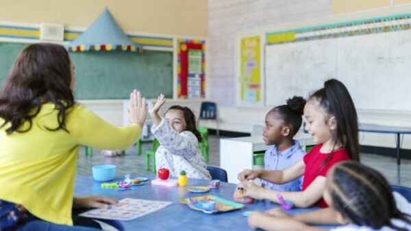 Bright young children with a teacher