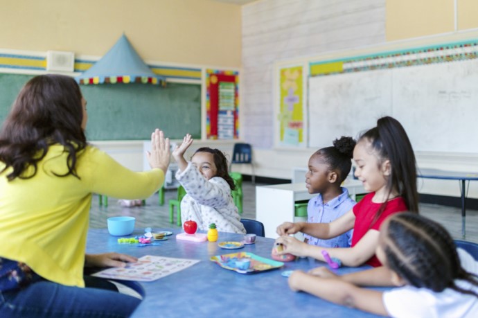 Bright young children with a teacher